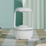 Aromaterapidiffusor i form av en vit moln, som sprider aromatisk ånga i ett rum, idealisk för avkoppling och välbefinnande.