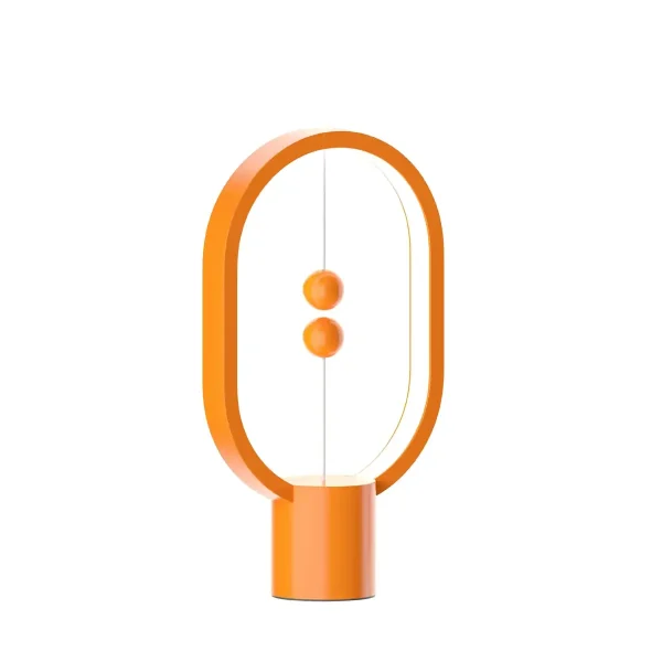 Modern skrivbordslampa i orange oval form med två knappar i mitten, perfekt för vetenskaplig eller modern dekoration.