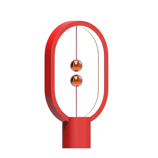 Newton lampa i röd glas med oval metallram, modern och vetenskaplig design, perfekt för kontors- eller vardagsrumsdekoration.