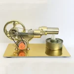 Miniatyrmodell av en ångkolv i förgyllt mässing, med hjul och cylinder, används som vetenskaplig dekoration eller samlarobjekt.