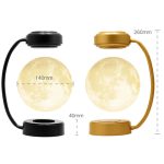Skrivbordslampa i form av en måne med mjukt ljus, tillgänglig i svart och guld, idealisk för inredning och stämningsbelysning.