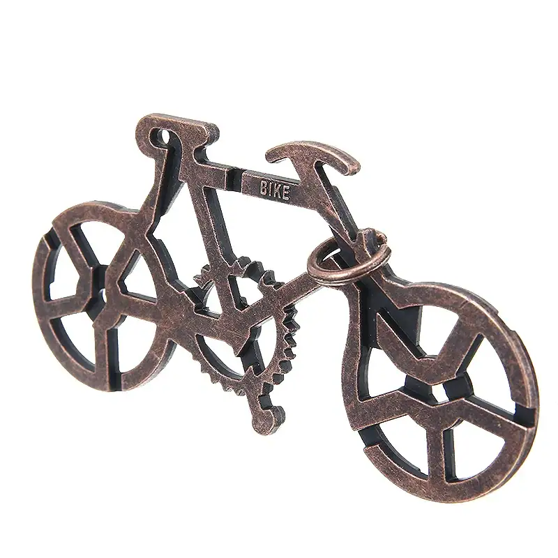 Nyckelring eller dekorationsobjekt i form av cykel i metall, idealisk för vetenskaps- och industriell designentusiaster.