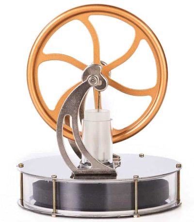 Newton-pulley med glascylinder, klassisk fysikdemonstration som illustrerar bevarande av rörelsemängd och kinetisk energi.