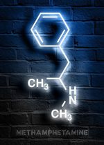 Molekylär struktur av metamfetamin i neon på en vägg av blå tegelstenar.