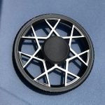 Motorrem för kaffemaskin, reservdel i svart plast med en vit stjärndesign, används för rörelseöverföring i hushållsapparater.