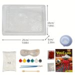 Set för vetenskapligt experiment av vulkanutbrott, inklusive en platta, vulkanpulver, färgämnen, penslar och tillbehör för simulering.