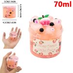 Liten burk med rosa persikogeled med fruktsdekorationer och ögon, innehållande 70 ml, idealisk för dekoration eller vetenskaplig samling.