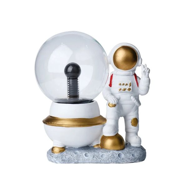 Vetenskaplig dekoration med astronaut och snöglob, idealisk för en rymd- och pedagogisk atmosfär i ditt hem.