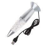 Skrivbordslampa i meteoritsform med glittrande ljus, originell design för vetenskaplig inredning eller utrymme.