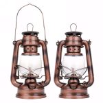Vintage lampa i koppar med transparent glas, perfekt för inredning inomhus eller utomhus.