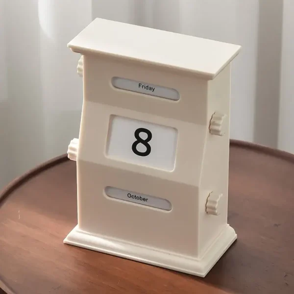 Vintage kontorskalender i form av möbel med visning av dag, månad och datum, perfekt för vetenskaplig eller retro dekoration.