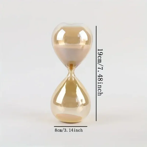Transparent glas timer med beige sand, som mäter 19 cm hög och 8 cm bred, idealisk för vetenskaplig dekoration eller som ett originellt kontorsobjekt.