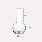 Laboratorieglasburk med en höjd på 7,5 cm och en diameter på 5,5 cm, idealisk för vetenskapliga experiment eller dekoration.