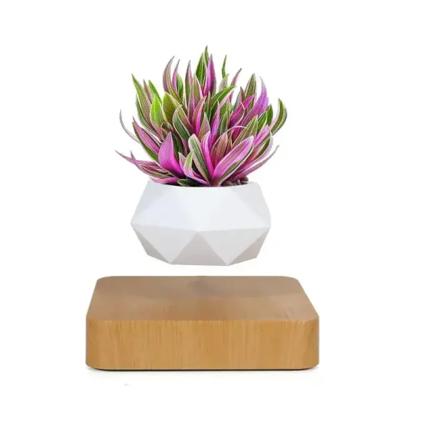 Konstgjord växt i vit kruka med gröna och rosa blad, modern och vetenskaplig dekoration.