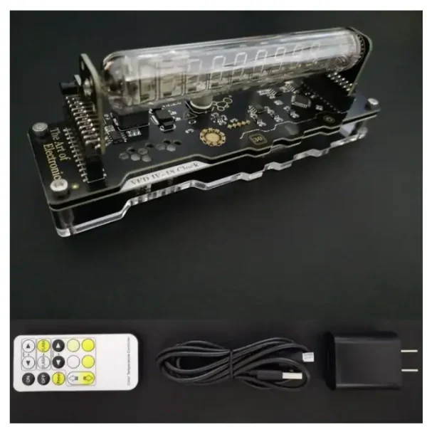 Elektroniskt kontrollpanel med digital visning, fjärrkontroll, USB-kabel och nätadapter för vetenskapliga experiment.