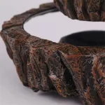 Dekorativ cirkel i natursten med texturerad yta och polerad finish, idealisk för inredning inomhus eller utomhus, som ger en elegant och naturlig touch till ditt utrymme.