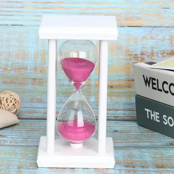 Glas sandtimer med rosa sand, elegant vetenskaplig dekoration.