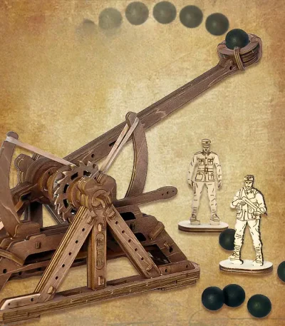Fysikspel med en trämekanism och svarta kulor som illustrerar rörelse och gravitation.