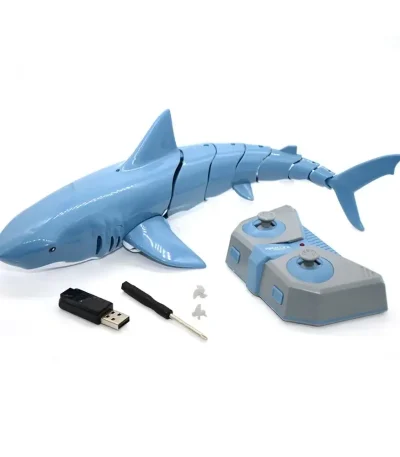 Utbildningsrobot i form av en blå plasttiger med fjärrkontroll, USB-minne och tillbehör för interaktivt lärande.