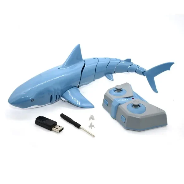 Utbildningsrobot i form av en blå plasttiger med fjärrkontroll, USB-minne och tillbehör för interaktivt lärande.