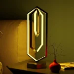 Dekorativ lampa i form av siffran 0 med varm LED-belysning, samtida design, idealisk för vetenskaplig eller modern inredning.