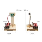 Vetenskaplig bänk med motor, sensor och strömförsörjning, idealisk för utbildningsexperiment i fysik och ingenjörsvetenskap. Mått: 11,5 cm hög, 12 cm bred, bas 7,5 cm.