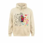 Hoodie med neurovetenskapstema med illustration av en färgglad hjärna och konstnärliga element, perfekt för vetenskaps- och konstentusiaster.